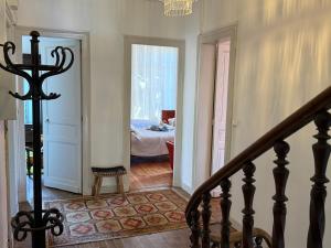 a hallway with a staircase leading to a bedroom at Lingaillat in Soorts-Hossegor