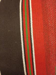a close up of a red and green stripe on a hat at Rum Towers Luxury Camp in Aqaba