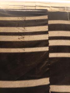 a black and white rug with white stripes at Rum Towers Luxury Camp in Aqaba