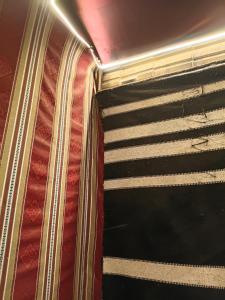 a close up of an opened suitcase on a bed at Rum Towers Luxury Camp in Aqaba