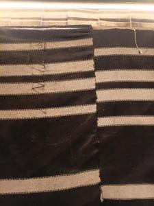 a black and white rug with white stripes at Rum Towers Luxury Camp in Aqaba