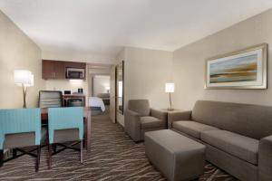 a living room with a couch and a dining room at Embassy Suites by Hilton Lompoc Central Coast in Lompoc