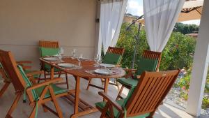 a dining room with a table and chairs at Villa Charme & Relax in Campofelice di Roccella