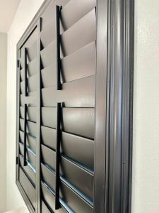 a stainless steel refrigerator in a room at Nubell Motel in Bell