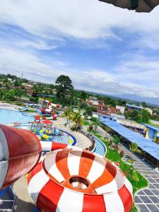a view of a pool at a water park at Manna Hotel Pematangsiantar in Pematangsiantar
