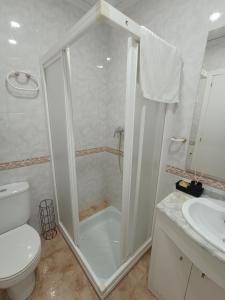a bathroom with a shower and a toilet and a sink at Casa el Pato Lolo in Bolbaite +24 photos
