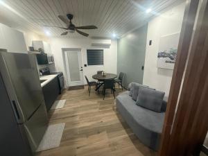 a living room with a couch and a table at Josie Cozy Corner in Grand Turk