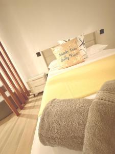 a bedroom with a bed with a pillow on it at Josie Cozy Corner in Grand Turk
