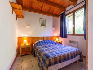 a bedroom with a bed and two night stands at Chalet in Vosges Forest with Valley View in La Bresse