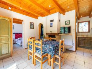 a kitchen and dining room with a table and chairs at Chalet in Vosges Forest with Valley View in La Bresse