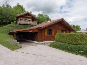 a house with a balcony on top of it at Chalet in Vosges Forest with Valley View in La Bresse