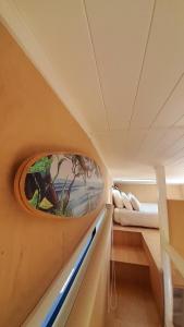 a room with a window on the wall with a bed at The Tiny Diamond in Diamond Harbour