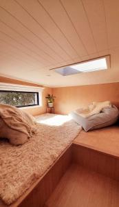 a bedroom with a large bed in a house at The Tiny Diamond in Diamond Harbour