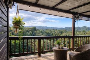 a balcony with a view of the mountains at Doa Blanca Cabin Mountain View in Utuado +15 photos