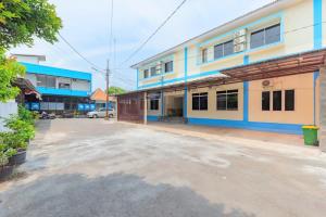 an empty parking lot in front of a building at Graha Citra Cirebon in Cirebon