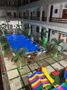 an overhead view of a swimming pool in a hotel at Residencial Ibiapaba - APARTAMENTO COMPLETO in Camocim