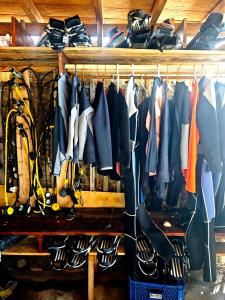 a bunch of clothes are hanging on a rack at Goroadventures and Dive Resort in Gorontalo +19 photos