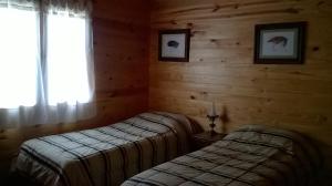 Ένα ή περισσότερα κρεβάτια σε δωμάτιο στο The Old Viking Fly Fishing- Alojamiento