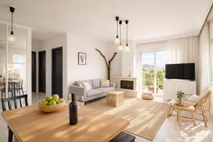 a living room with a couch and a table at 3BR Suite 300mts from the Beach in Perea