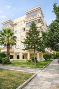 an apartment building with trees in front of it at 3BR Suite 300mts from the Beach in Perea