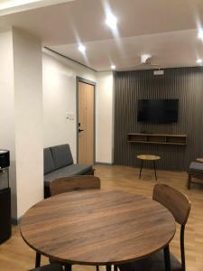 a living room with a table and a couch at GQ Apartment in Aklan