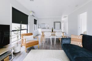 a living room with a couch and a dining room at King Bed, 3 Beds, 2 bath, Sleeps 6 in Sale