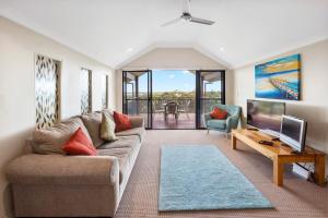 a living room with a couch and a tv at Sea Forth on Otter in Quindalup