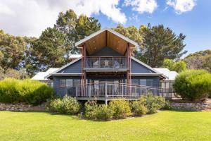 a house with a large deck with a balcony at Sea Forth on Otter in Quindalup
