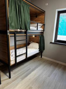 a bunk bed room with two bunk beds in it at HOSTEL Q7 Almaty in Almaty