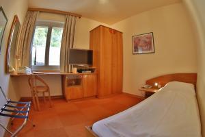 Postel nebo postele na pokoji v ubytování Hotel Restaurant Marko