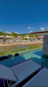 a view of a swimming pool at a resort at Île Lumière in Pipa