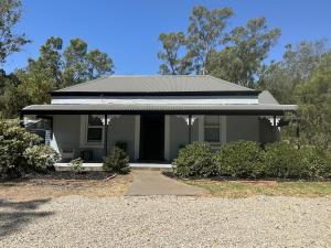 a gray house with a black roof at Clare Cottage on Wendouree in Clare