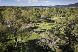 an aerial view of a house in the middle of a forest at The Mini Chalet by Tiny Away in Bromfleet