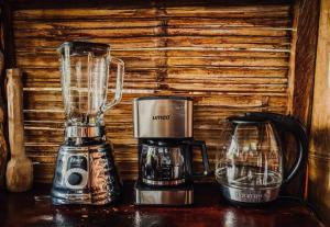 a blender and a coffee maker on a table at Toucan Lodge Amazon Rainforest Retreat in Tarqui