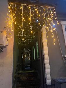 a string of lights hanging from the ceiling of a house at Karhal Room in Edirne