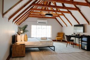 a bedroom with a bed and a desk at Uitsig Boutique Hotel in Welkom +233 photos