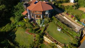 an overhead view of a house with a large yard at Amansara Bungalow - Panoramic Lake View Villa, Nuwara Eliya in Nuwara Eliya