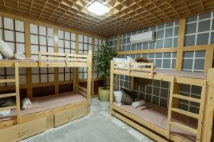 a room with three bunk beds in it at White House, Billiard, Private Pool, Prime Location in Angeles +31 photos