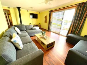 a living room with a couch and a coffee table at Blue Lagoon in American River