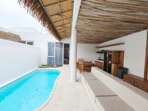 an indoor swimming pool in a villa at Villa Melody Uluwatu by LODGELINK BALI in Badung