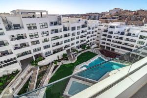 arial view of a large apartment building with a swimming pool at EG5.4A - Luxury Penthouse with Private Sun Terrace in Estepona