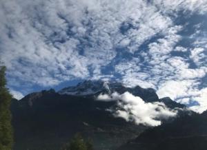 a view of a mountain under a cloudy sky at Hotel Sonam Chen Residency Lachung in Lachung