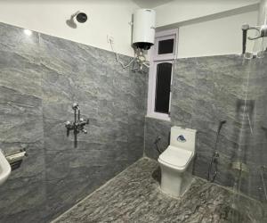 a bathroom with a toilet and a sink at Hotel Sonam Chen Residency Lachung in Lachung