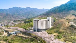 an aerial view of a building on a mountain at KensingtonResort JirisanHadong in Hadong