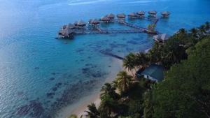 an aerial view of a resort in the ocean at Eli Beach House in Vaiorea