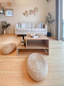 a living room with a couch and a coffee table at Wa no ka in Koga +27 photos