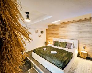 a bedroom with a large bed and a large wall at INsight - workcation oldtown in Ingolstadt