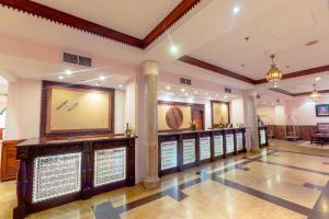 a lobby of a hotel with a bar at Dar es Salaam Serena Hotel in Dar es Salaam +91 photos