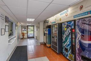 a hallway of a hospital with vending machines at Motel 6-Oshkosh, WI in Oshkosh