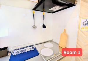 a small kitchen with a sink and a dishwasher at MORIHIRO Building in Ichikawa +80 photos